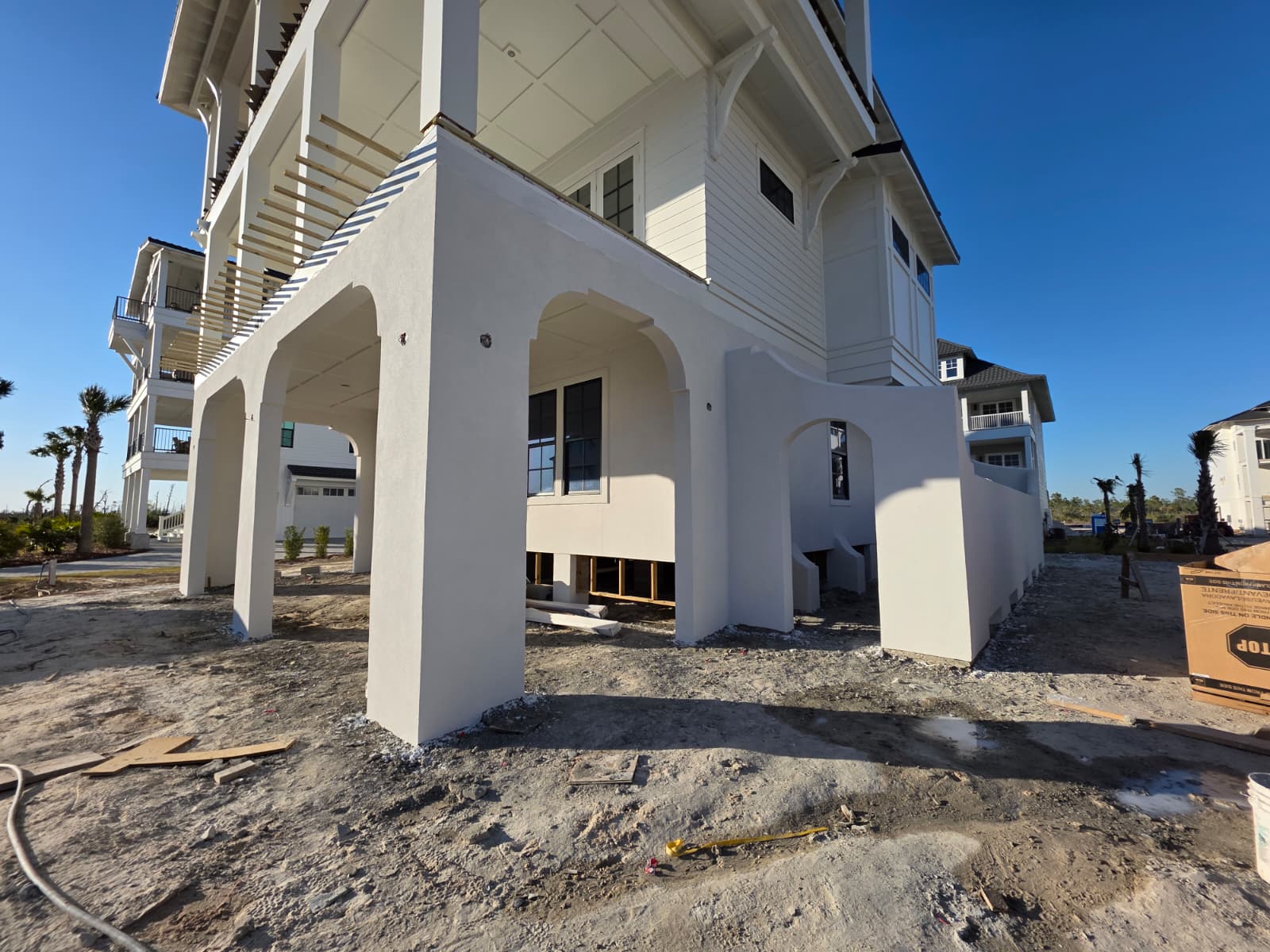 Luxury estate with decorative stucco columns and arches
