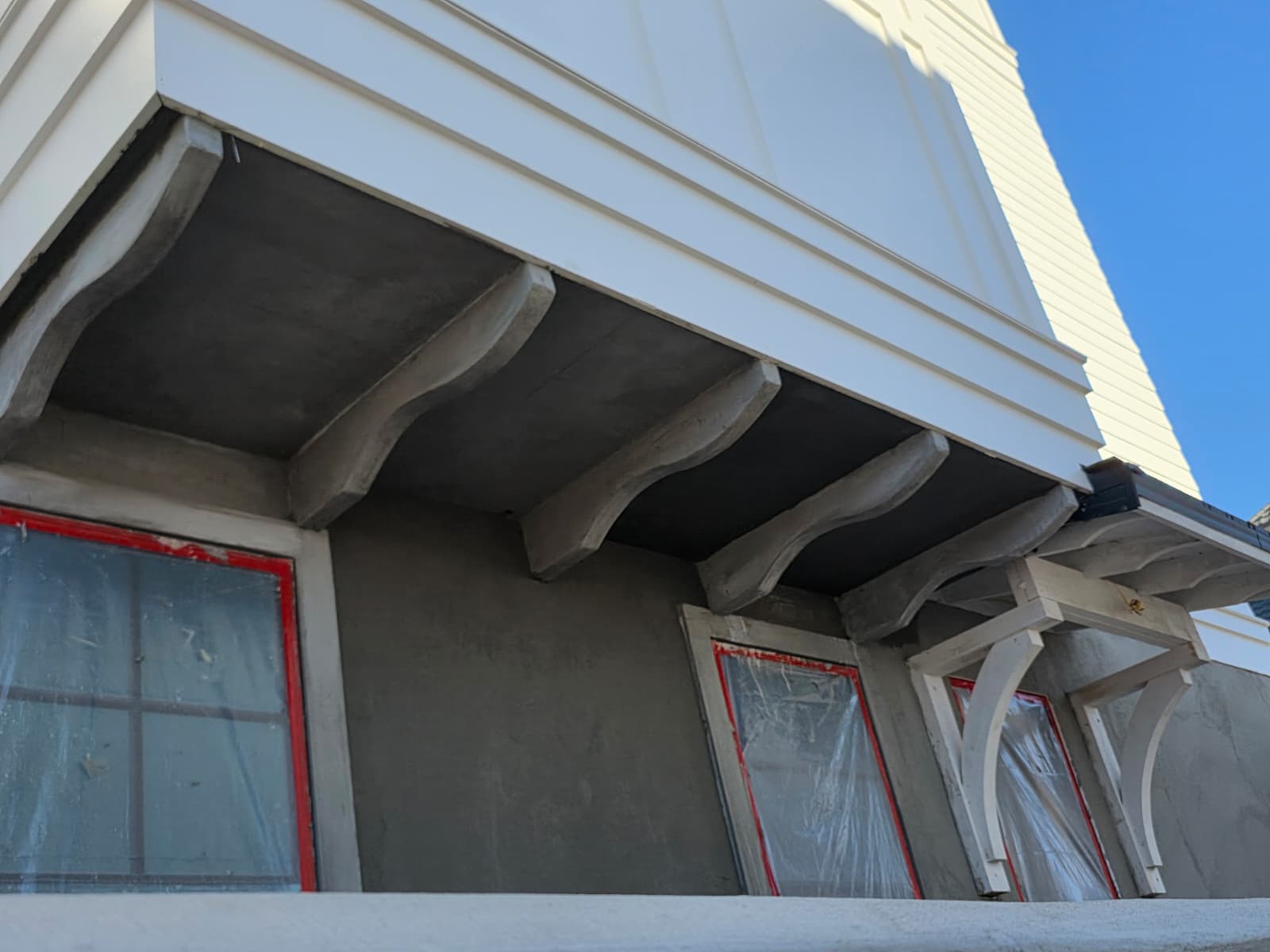 Stucco corbels and decorative bracket detail