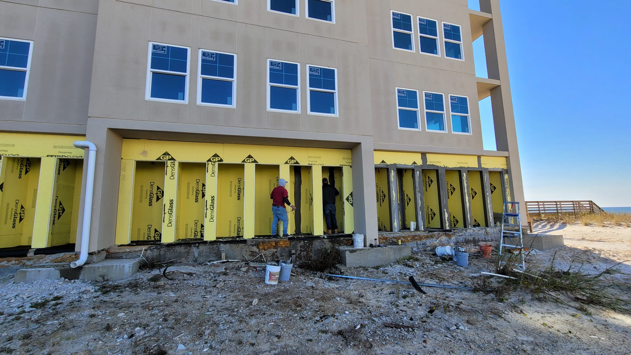 Multi-unit townhome stucco in progress