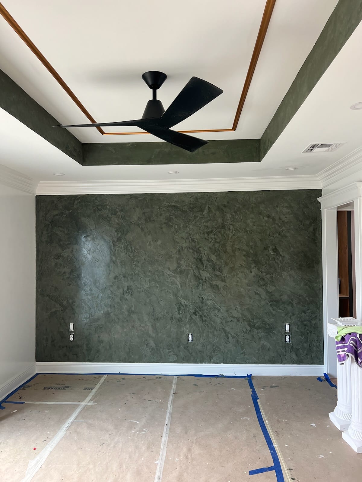 Venetian plaster dark accent wall interior